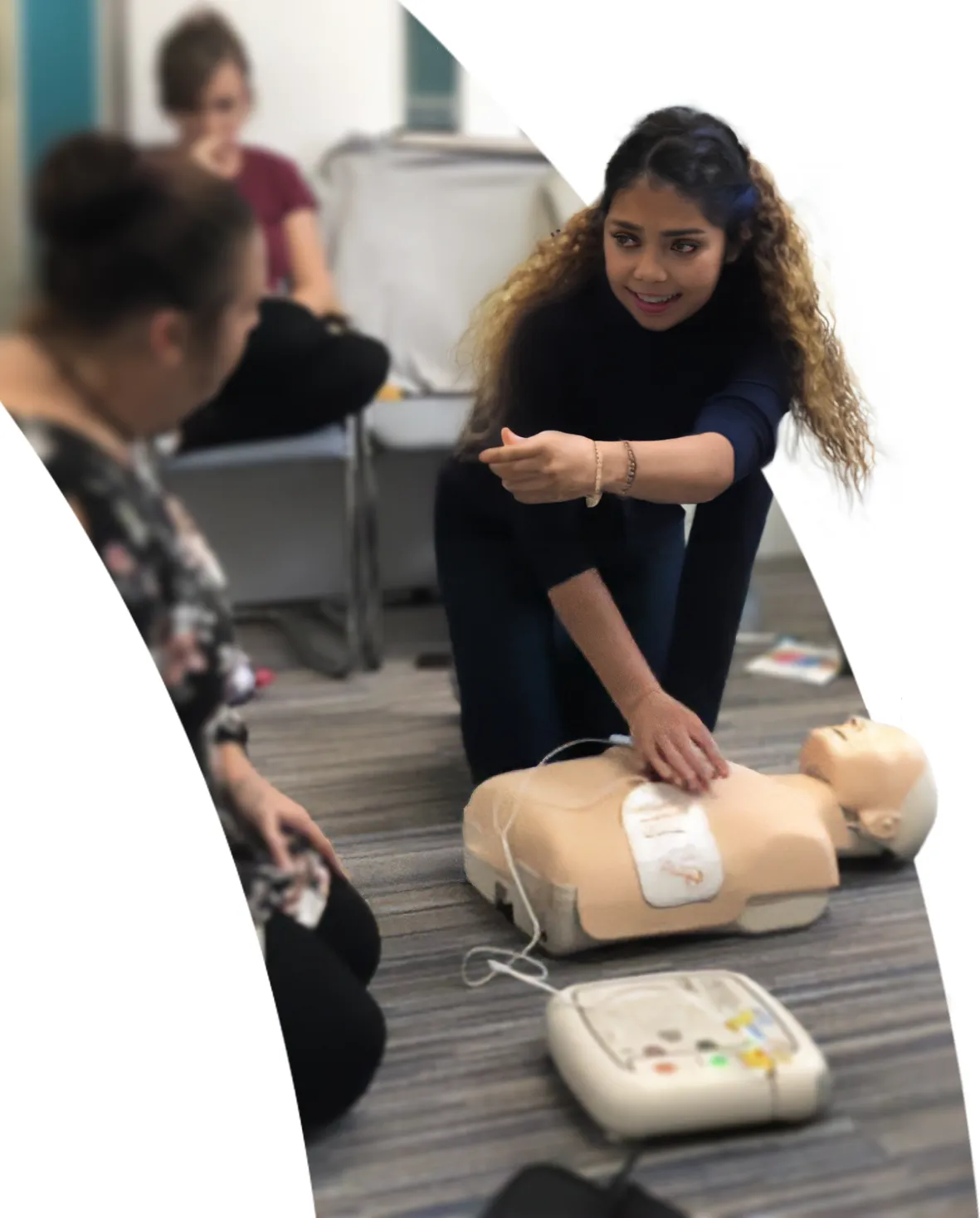 Employees participating in workplace first aid training session