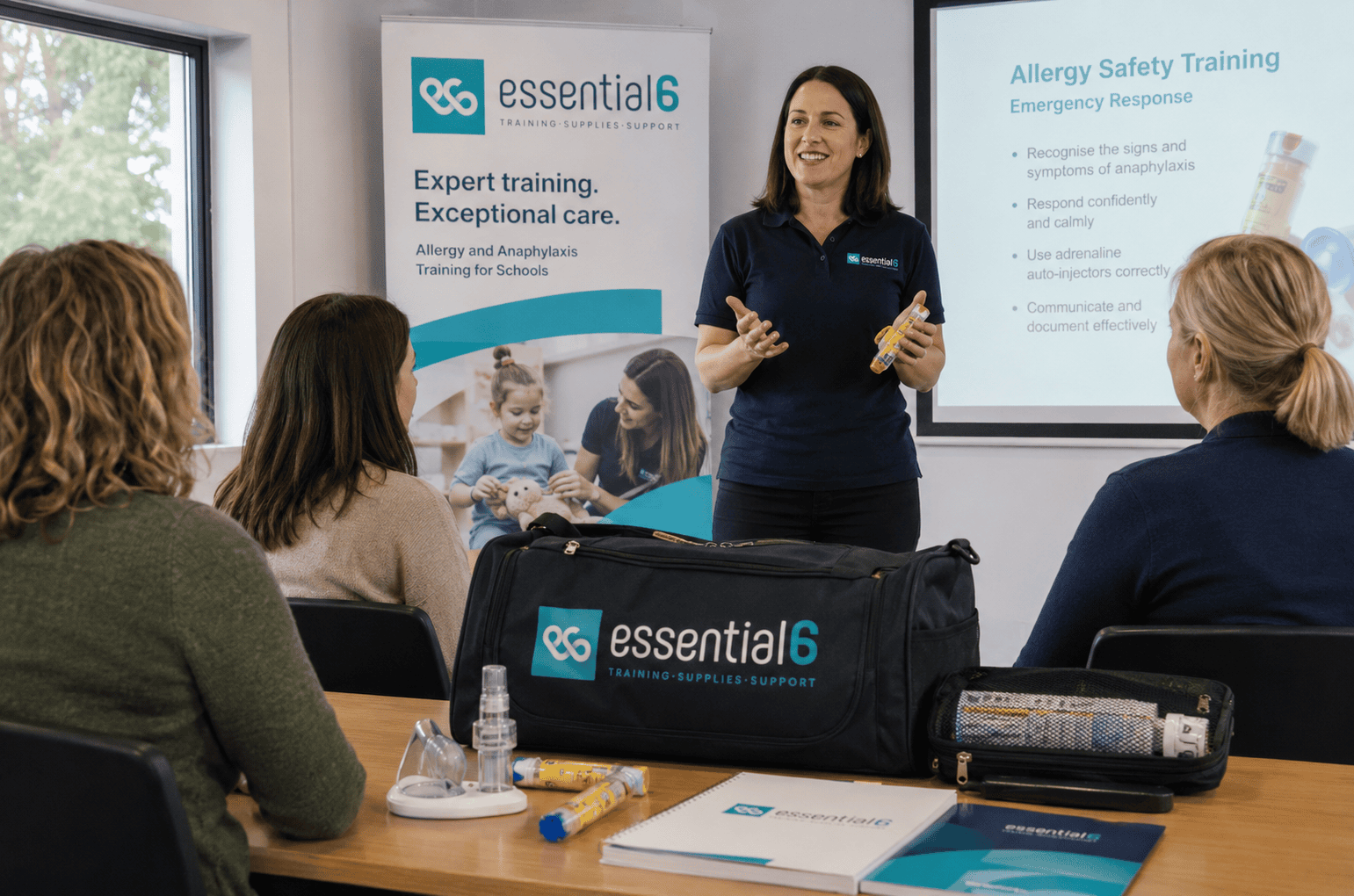 Essential 6 trainer demonstrating an emergency adrenaline device during allergy training for school staff