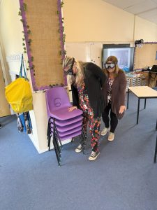 Fire warden delegate experiencing reduced visibility using smoke-simulation goggles